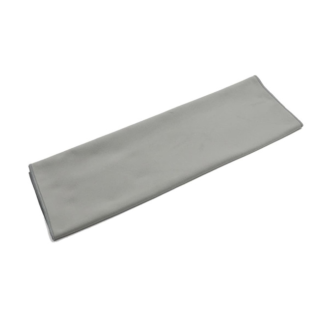 A grey quick dry towel with a smooth surface and stitched edges, featuring a small logo.