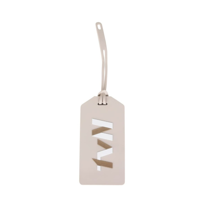 A custom-shaped PVC luggage tag in a light beige colour with cut-out detail and a flexible attachment.