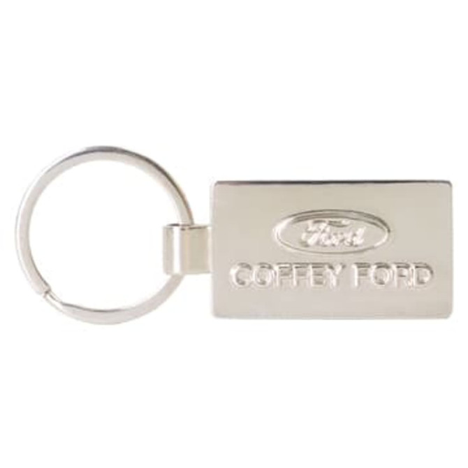 A silver custom-shaped die struck keyring with a logo and branding details.