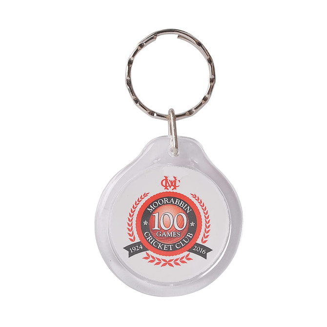 A round acrylic keyring with a silver metal keychain, featuring red and black branding elements.