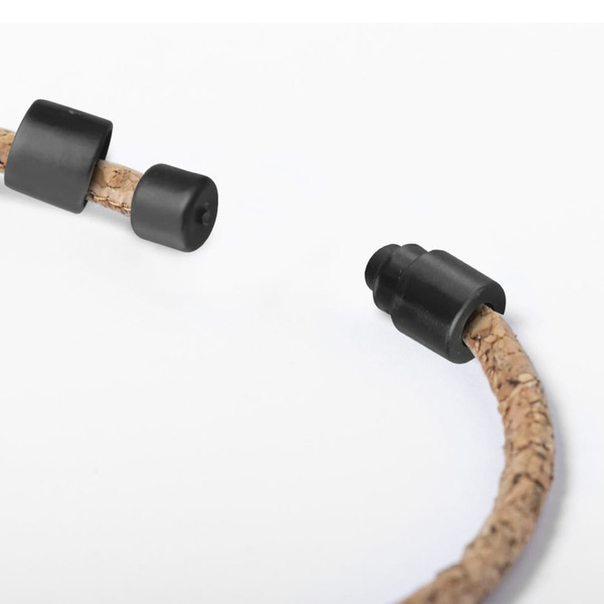 A cork lanyard featuring black plastic fittings, showcasing a natural cork texture.