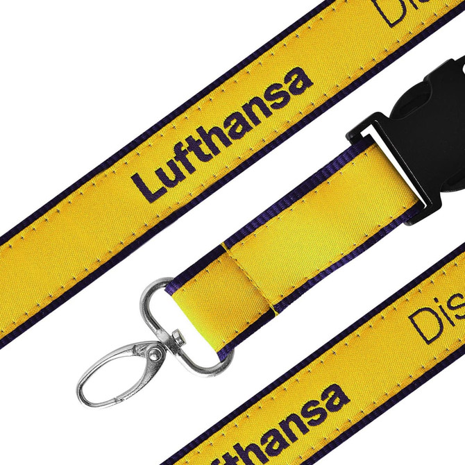 A detailed woven lanyard in yellow with a purple edge and a metal clasp. It features a branding logo.