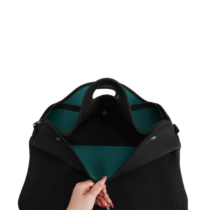 A black laptop bag with a teal interior, featuring a handle and a zippered opening.