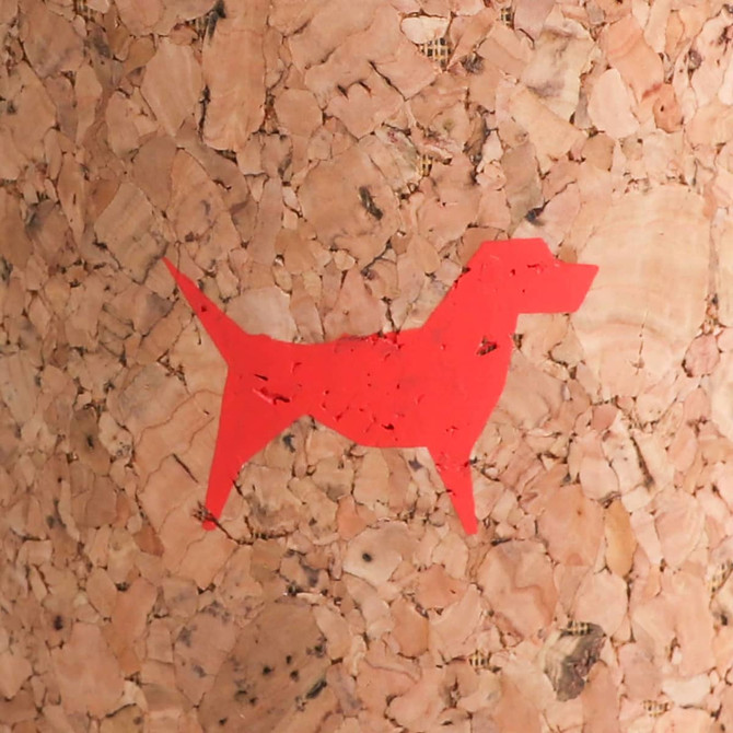 A flat packed cork stubby holder featuring a red dog silhouette against a natural cork background with a logo.