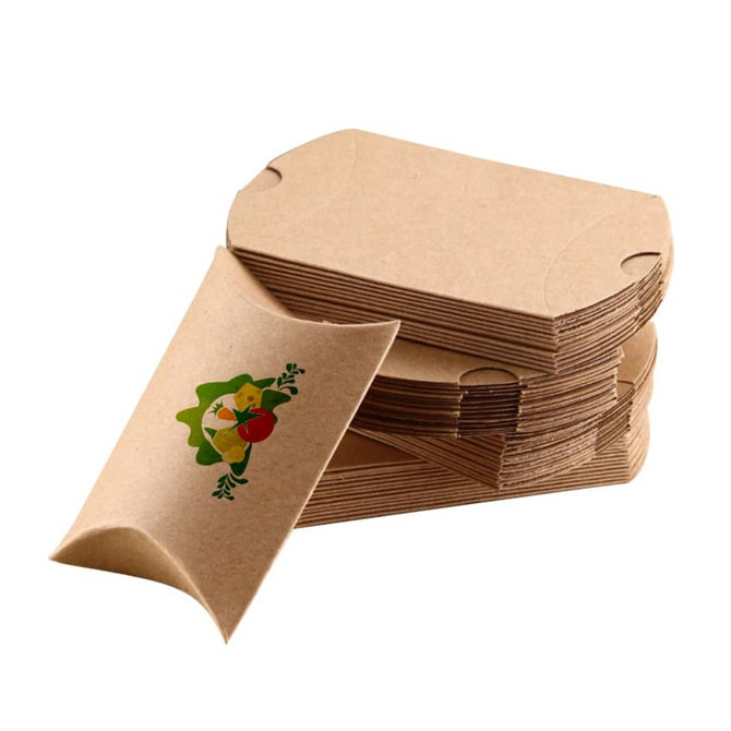 A stack of small brown kraft pillow boxes with a floral design on one box. Each box has a smooth finish.