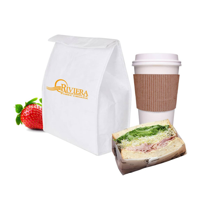A white Tyvek cooler lunch bag, a coffee cup with a sleeve, a sandwich, and a strawberry. The bag features a logo.