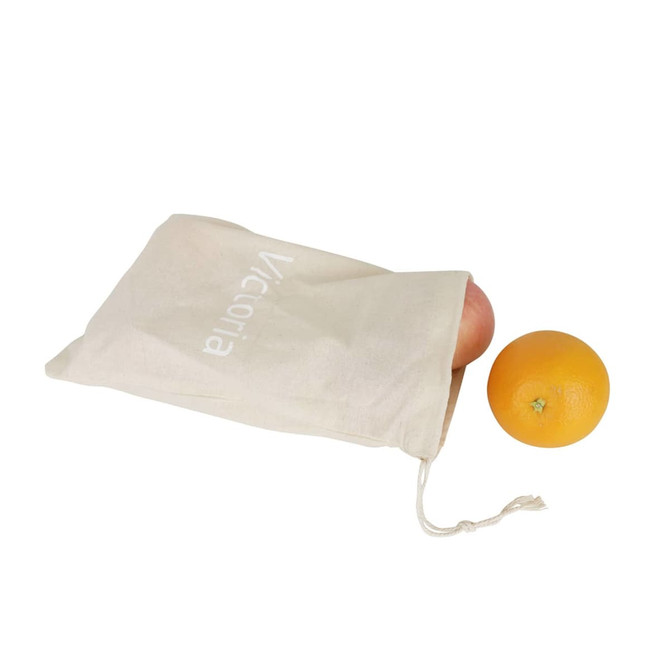 A large cream cotton produce bag partially filled with an apple and an orange, featuring a logo.
