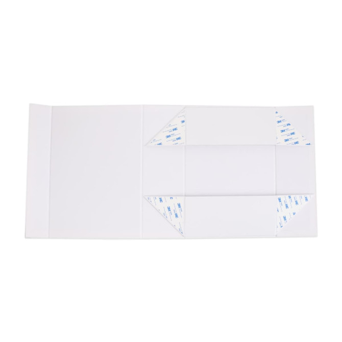 A foldable magnetic box in white with adhesive corners, designed for packaging with an elegant ribbon.