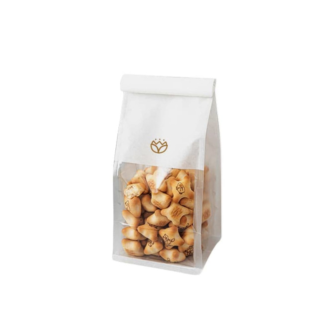 A white and clear bag filled with star-shaped cookies, featuring a logo on the front.