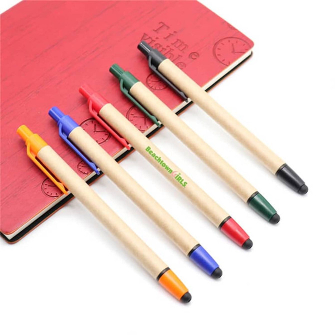 A collection of five stylus pens in blue, red, green, black, and orange placed on a red notebook. Each pen features a touch head.