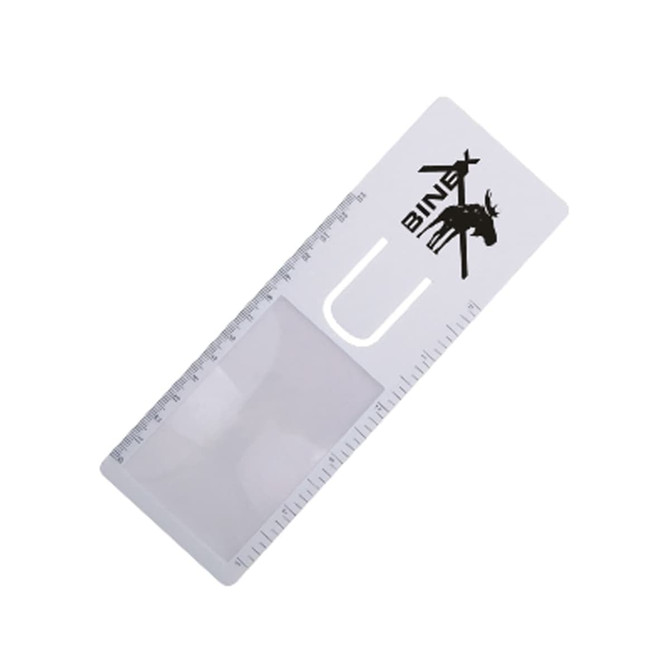 A transparent magnifying bookmark with a ruler along one edge and a logo in black.