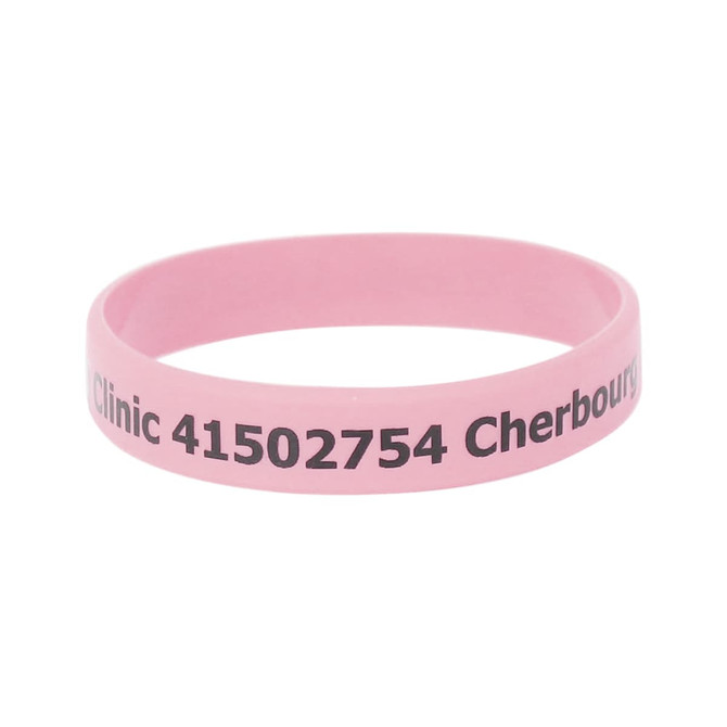 A pink silicone wristband featuring printed text and a logo. Ideal for promotional events or exhibitions.