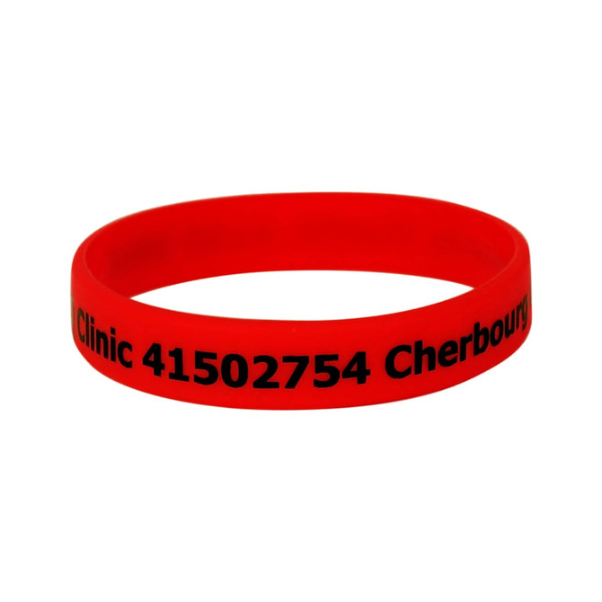 A red silicone wristband featuring black text and a logo.