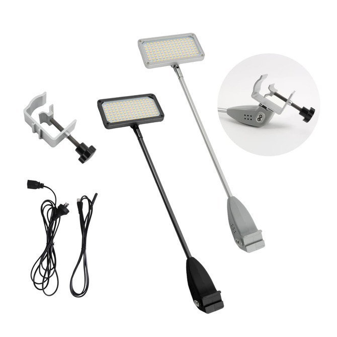 Two inclined display lights in black and grey, with clamps and cables included for setup.