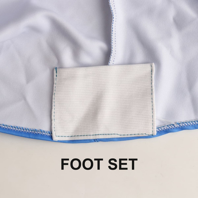 A close-up of a white and blue tablecloth featuring a foot set section. It includes a logo.