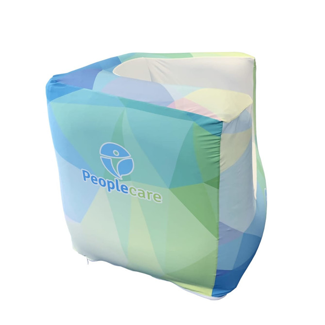 An inflatable one-seat sofa in blue and green geometric patterns, featuring a logo on the side.