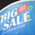 A vibrant blue tent billboard banner featuring the text "Big Sale" with a red "25% Off" highlight and circular accents.