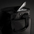 A black cooler bag featuring a silver insulated interior and a zippered opening, with sturdy handles and a logo.
