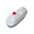 A white stress reliever shaped like a cruise ship, featuring a red top and green grid pattern on the sides.