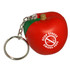 A red apple-shaped stress reliever with a silver keyring attachment and a logo on the front.