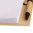 A memo pad with white pages and a brown cover, accompanied by a black ballpoint pen.