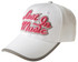 A white cap with pink lettering that reads "Lost In Music" and a grey peak trim. The cap features a logo.
