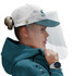 A white and teal cap with a clear protective visor, worn by a person with a bun hairstyle.