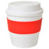 A drink cup in white with a red silicone band, featuring a lid and a smooth finish. It has a logo on the side.
