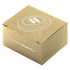 A round, silver car vent mount in a box made of wheat fibre, featuring a logo on the top.