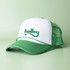 A green and white trucker cap with a mesh back and a logo on the front.