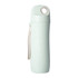 A drink bottle in pastel green made from wheat straw, featuring a logo and a carrying strap.