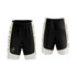 Basketball shorts in black with white and yellow accents, featuring a logo on the side.