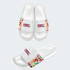 A pair of white slides featuring a vibrant patterned strap with a logo. The slides have a glossy finish.