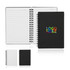 A spiral-bound A6 notebook with a black cover and colourful branding, featuring lined pages inside.