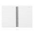 A spiral-bound A6 notebook with blank white lined pages and a black spiral binding.
