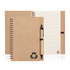 A recycled paper spiral-bound notebook in brown with a black logo and a matching pen alongside.
