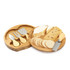 A cheese set featuring five stainless steel utensils on a bamboo platter with assorted cheeses and crackers.