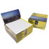 A card memobox with a scenic city skyline design, containing white memo papers. Predominantly yellow and featuring a logo.