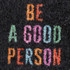 A black nylon logo mat featuring colourful text that reads "BE A GOOD PERSON."