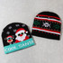 Two knitted beanies, one featuring a Santa design in red, white, and green, and the other with a festive pattern in black and red.
