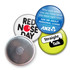 A collection of four button badges featuring various colours, designs, and a metallic backing.