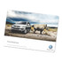A counter mat featuring a grey SUV beside a rhinoceros in a desert landscape, with a logo at the bottom.