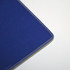 A blue welded mouse mat with a smooth surface and rounded edges. It features a subtle logo in one corner.