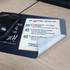 A microfiber mouse mat featuring a checklist design, predominantly in dark colours with a smooth surface.