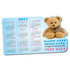 A magnetic calendar featuring a teddy bear, displaying the months of the year with red and blue details.