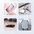 A collection of items including a smartphone, keys, a wallet, and a suitcase, all set on a light background.