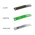 A set of three golf divot tools in black, green, and silver, each featuring a different brand logo or engraving.