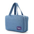 A large blue hanging toiletry bag with two handles and a branded logo.