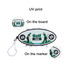 A golf tee set featuring a black and white design with green accents, including a clip for easy attachment.