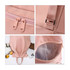 A pink backpack featuring dual zippers, a handle, an adjustable strap, and a transparent compartment.